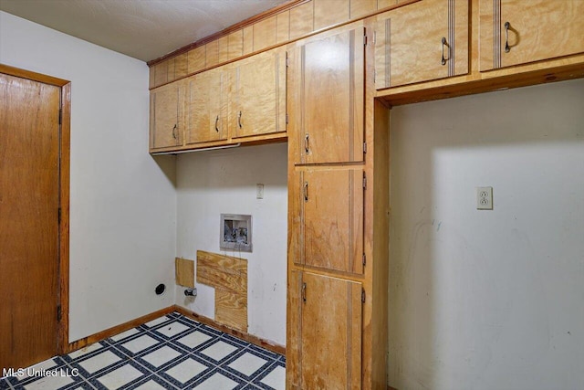 washroom featuring washer hookup and cabinets