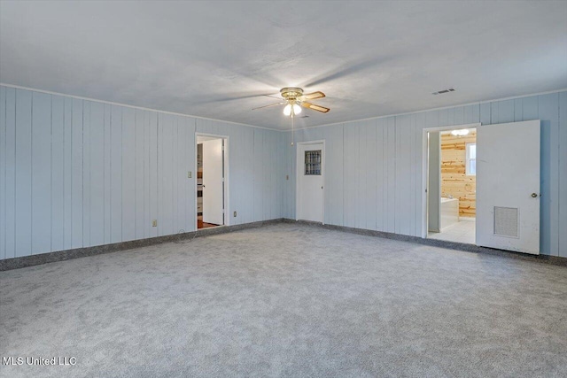 unfurnished room with carpet floors and ceiling fan