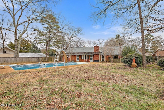 view of yard with a fenced in pool