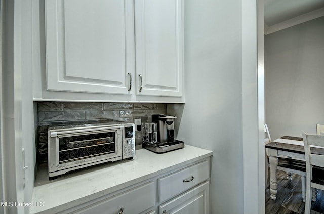 bar with backsplash and a toaster