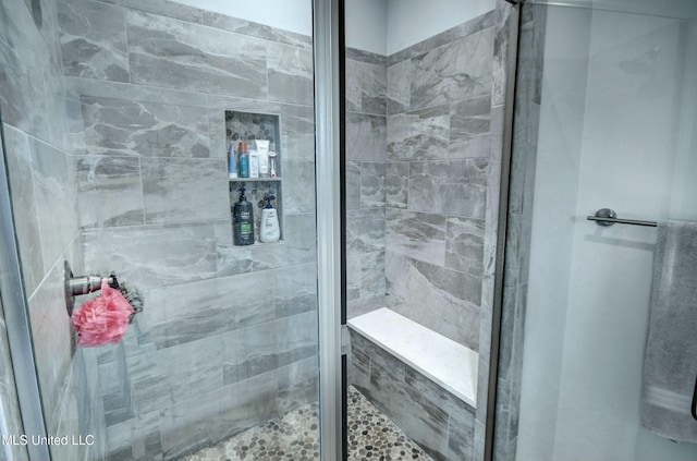 full bathroom featuring a stall shower