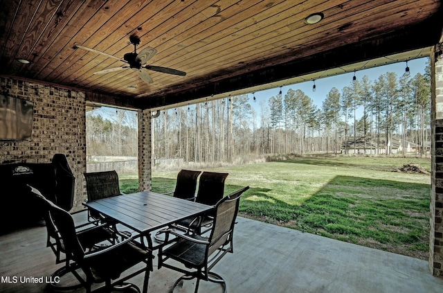 view of patio / terrace with outdoor dining area, a ceiling fan, and fence