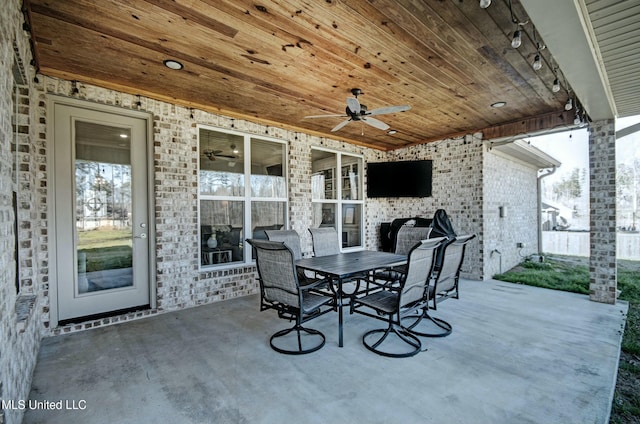 view of patio / terrace featuring outdoor dining area and a ceiling fan