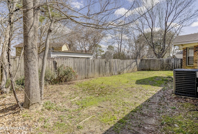 view of yard with a fenced backyard and cooling unit