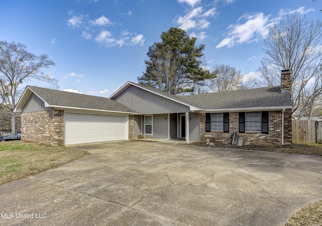 ranch-style home featuring fence, brick siding, concrete driveway, a garage, and a chimney