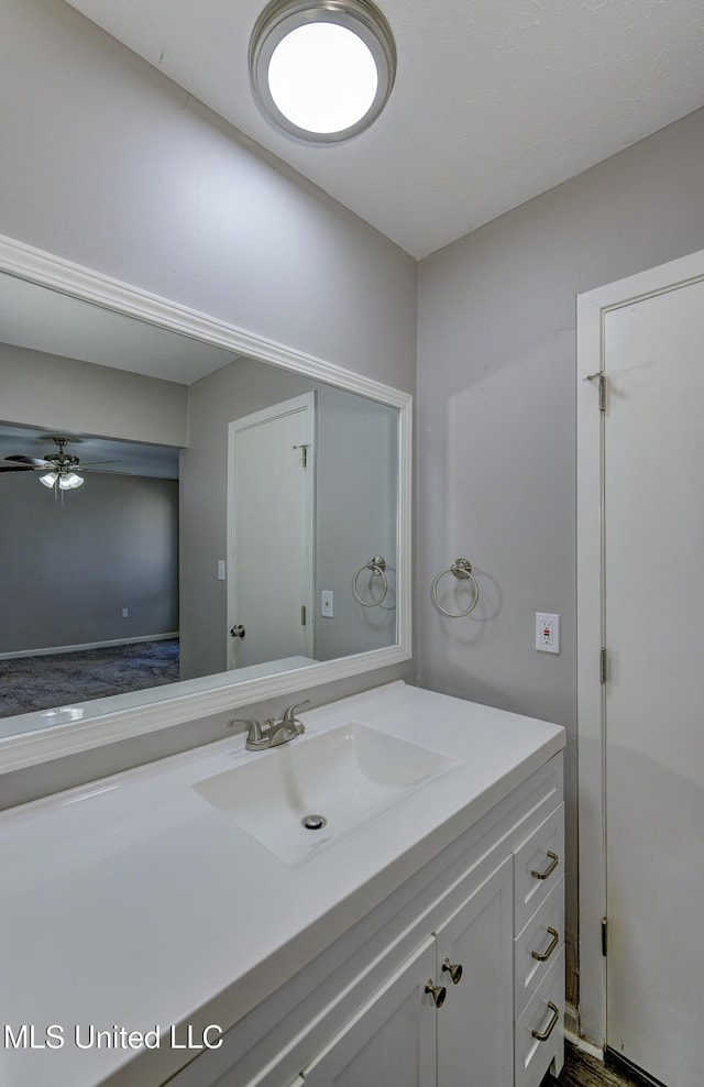 bathroom featuring vanity and a ceiling fan