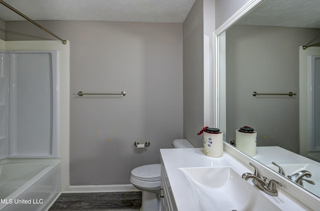 full bathroom with toilet, shower / washtub combination, wood finished floors, vanity, and baseboards