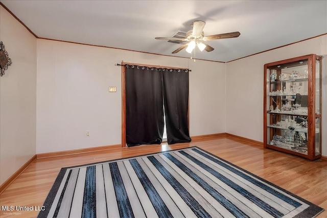 2880 Briarwood Dr, Horn Lake, MS 38637 - unfurnished room with light wood-style floors, a ceiling fan, and crown molding