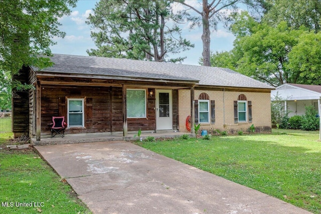 2880 Briarwood Dr, Horn Lake, MS 38637 - ranch-style home featuring a front lawn, brick siding, concrete driveway, and a shingled roof