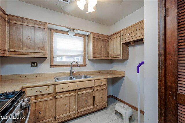 2880 Briarwood Dr, Horn Lake, MS 38637 - kitchen featuring light countertops, a ceiling fan, and gas stove