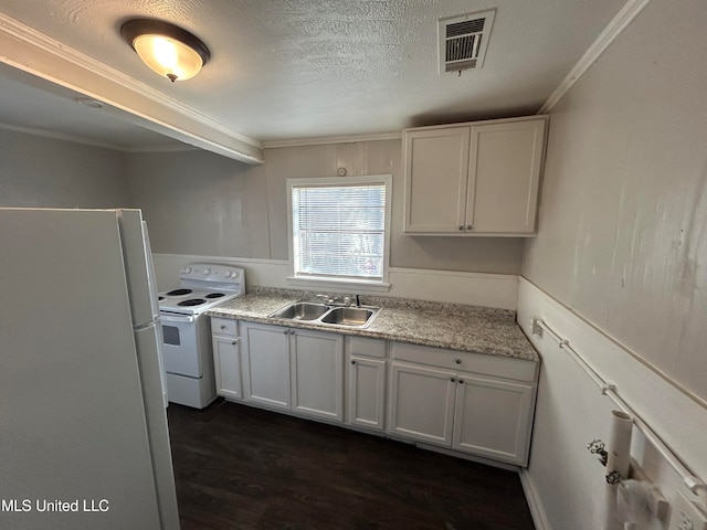 kitchen with white cabinetry, ornamental molding, dark hardwood / wood-style floors, sink, and white appliances