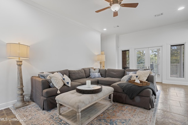 living room with ceiling fan, crown molding, and french doors