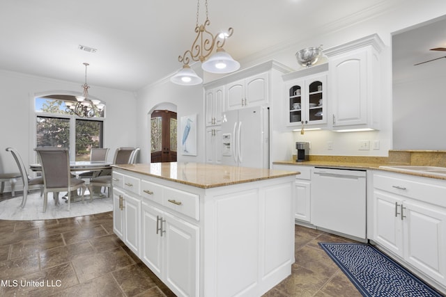 kitchen featuring white appliances, a center island, white cabinetry, and hanging light fixtures