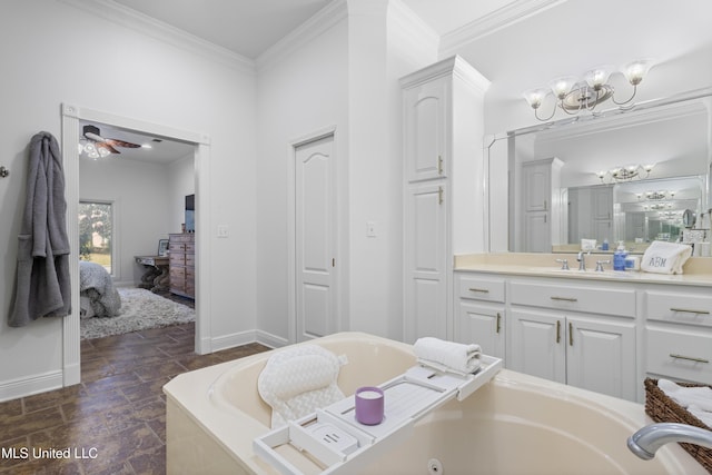 bathroom featuring a tub to relax in, vanity, ceiling fan with notable chandelier, and ornamental molding