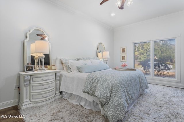 bedroom featuring ceiling fan and ornamental molding