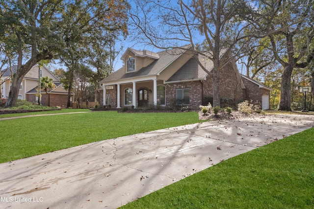 cape cod-style house featuring a front yard