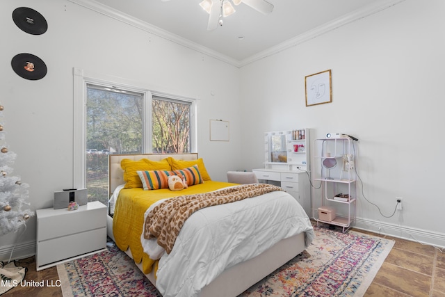 bedroom with ceiling fan and crown molding