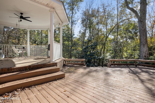 wooden terrace with ceiling fan and a porch