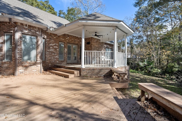 exterior space with ceiling fan and a porch