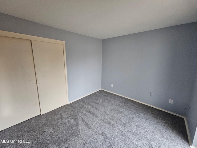 1074 Windrose Dr, Brandon, MS 39047 - unfurnished bedroom featuring carpet floors, baseboards, and a closet