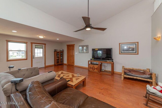 11088 Tahiti St, Bay Saint Louis, MS 39520 - living area featuring wood finished floors, baseboards, recessed lighting, ceiling fan, and a towering ceiling
