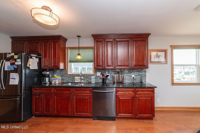 11088 Tahiti St, Bay Saint Louis, MS 39520 - kitchen featuring dishwasher, a sink, fridge with ice dispenser, dark brown cabinets, and tasteful backsplash