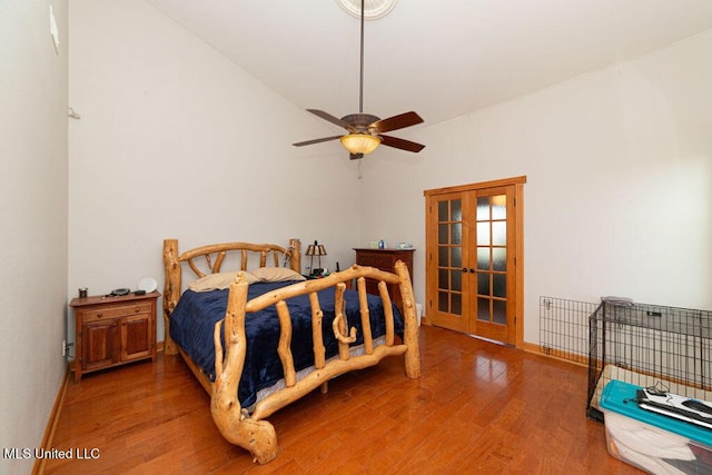 11088 Tahiti St, Bay Saint Louis, MS 39520 - bedroom with french doors, wood finished floors, lofted ceiling, and baseboards