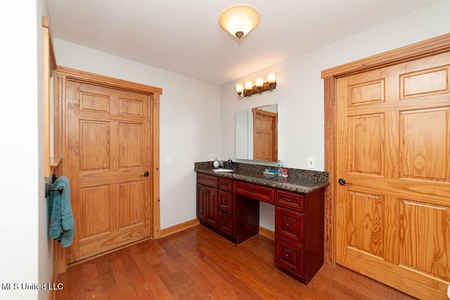 11088 Tahiti St, Bay Saint Louis, MS 39520 - bathroom with vanity, wood finished floors, and baseboards
