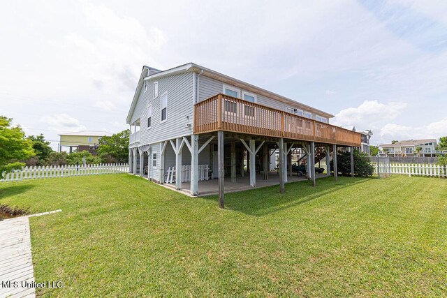 11088 Tahiti St, Bay Saint Louis, MS 39520 - back of house with a wooden deck and a patio area
