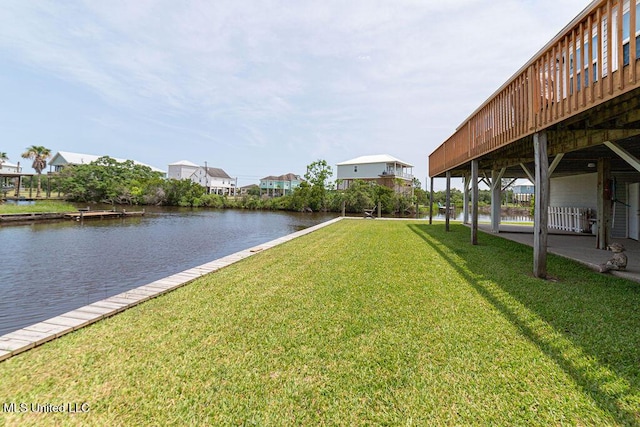 11088 Tahiti St, Bay Saint Louis, MS 39520 - view of grassy yard with a deck with water view and a residential view
