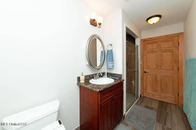 11088 Tahiti St, Bay Saint Louis, MS 39520 - full bath with toilet, vanity, a shower stall, and tile patterned flooring