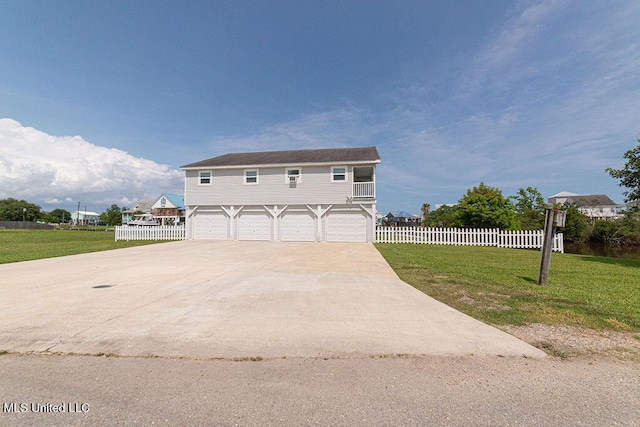 11088 Tahiti St, Bay Saint Louis, MS 39520 - view of front facade featuring a garage and concrete driveway