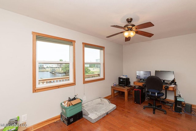 11088 Tahiti St, Bay Saint Louis, MS 39520 - office with light wood-type flooring, ceiling fan, and baseboards