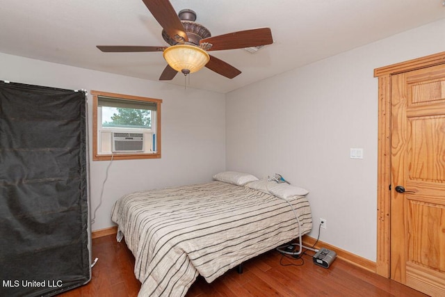 11088 Tahiti St, Bay Saint Louis, MS 39520 - bedroom featuring wood finished floors, baseboards, ceiling fan, and cooling unit