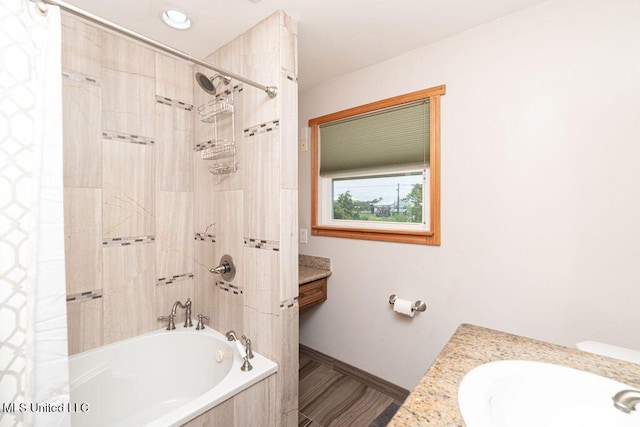 11088 Tahiti St, Bay Saint Louis, MS 39520 - full bathroom with vanity, tiled shower / bath combo, and baseboards