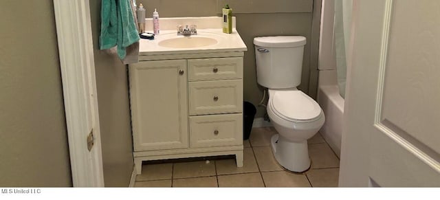 full bathroom with vanity, shower / bath combo with shower curtain, toilet, and tile patterned flooring