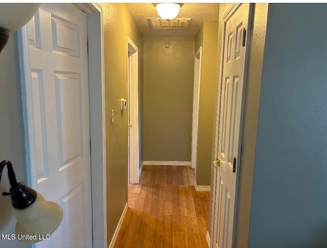 hall featuring light wood-type flooring