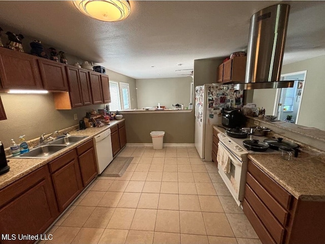 kitchen featuring kitchen peninsula, ventilation hood, sink, light tile patterned floors, and white appliances