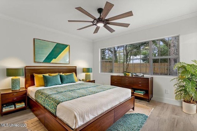 175 Saint Charles Ave, Biloxi, MS 39530 - bedroom with ornamental molding, light wood-style flooring, and ceiling fan
