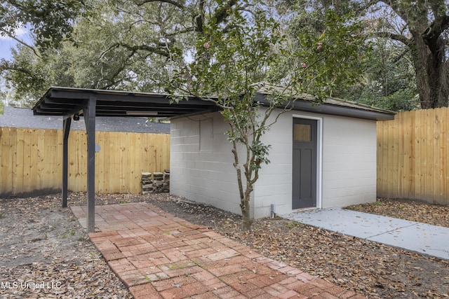175 Saint Charles Ave, Biloxi, MS 39530 - fenced backyard featuring an outbuilding and a patio area