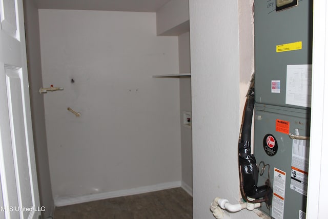 utility room with heating unit