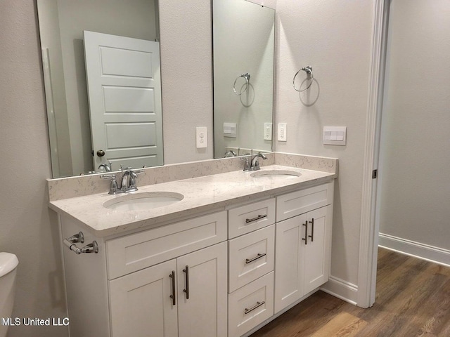 bathroom with vanity and hardwood / wood-style flooring