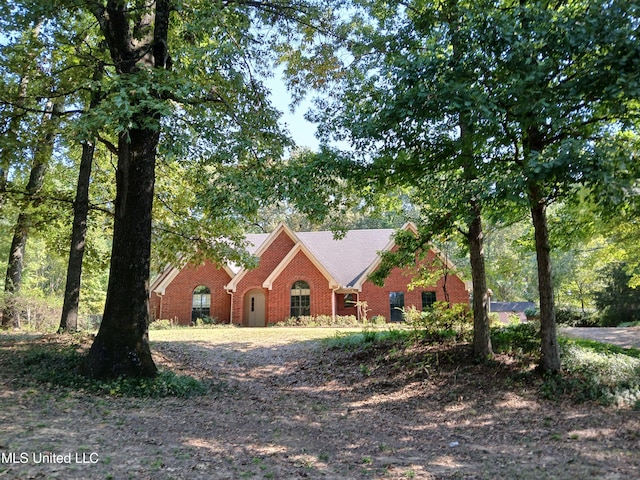 view of front of house with brick siding