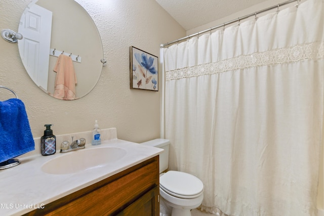 14174 Spruce Ct, Gulfport, MS 39503 - bathroom featuring toilet, vanity, a textured ceiling, a textured wall, and a shower with shower curtain