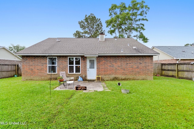 14174 Spruce Ct, Gulfport, MS 39503 - rear view of house featuring brick siding, a patio, a chimney, a fire pit, and a shingled roof