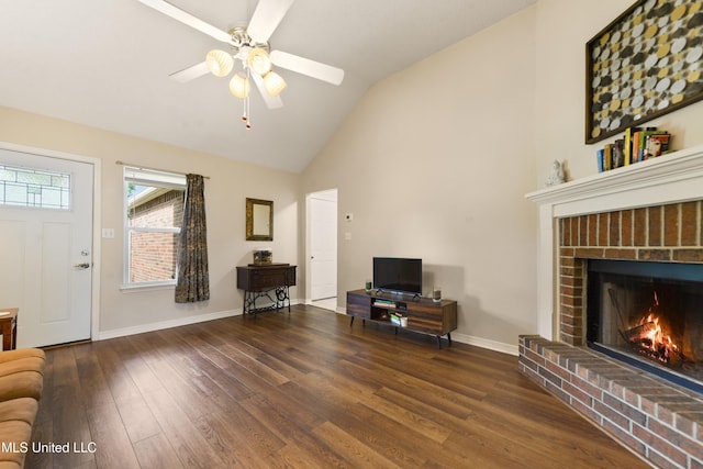 14174 Spruce Ct, Gulfport, MS 39503 - living room with a fireplace, a ceiling fan, wood finished floors, baseboards, and high vaulted ceiling