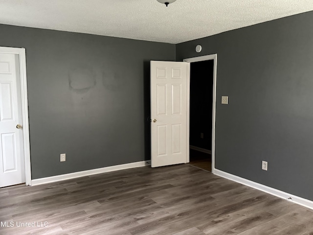 5704 Westminister Ln, Southaven, MS 38671 - unfurnished room with wood finished floors and a textured ceiling
