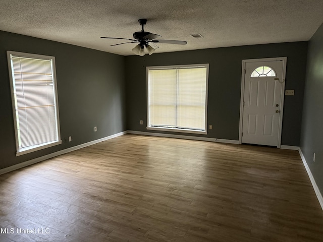 5704 Westminister Ln, Southaven, MS 38671 - entrance foyer with a ceiling fan, wood finished floors, and a textured ceiling