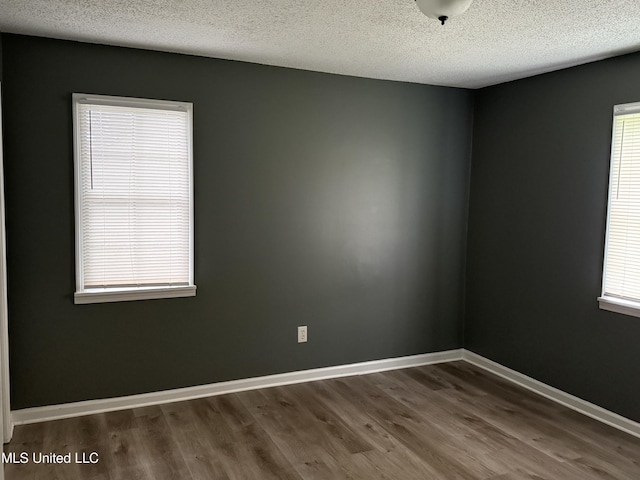 5704 Westminister Ln, Southaven, MS 38671 - empty room with wood finished floors and a textured ceiling