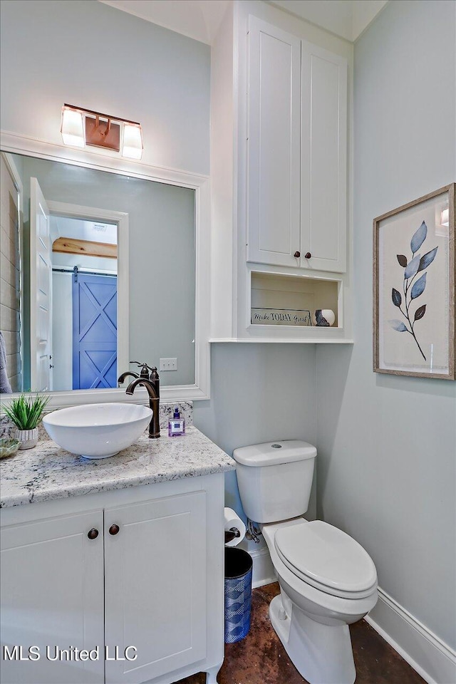 bathroom with vanity and toilet